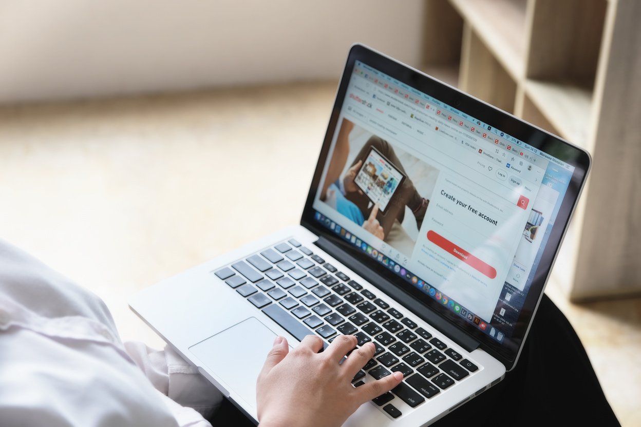 Chiangmai, Thailand - 7 Jun 2020:Woman Use Laptop Computer to Open Www Shutterstok for Buy Image to Commercial, an American Provider of Stock Photography, Stock Footage, Stock Music, and Editing Tool.